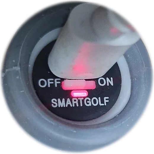 Club end with the USB cable in and the charging LED lit red